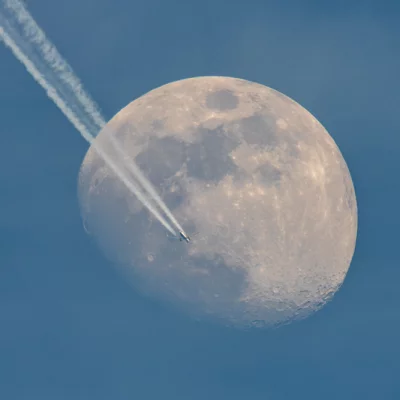 Airplane Crossing Moon