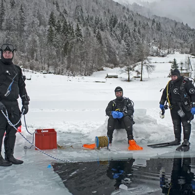 Three divers on an Icehole