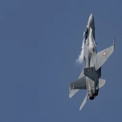 F/A-18 Hornet of Swiss Airforce with lateral chemtrails of Dihydrogenmonoxide